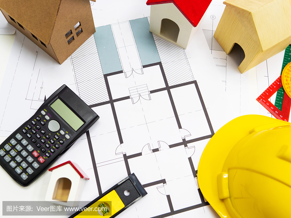建筑工程师房屋设计图工作台。